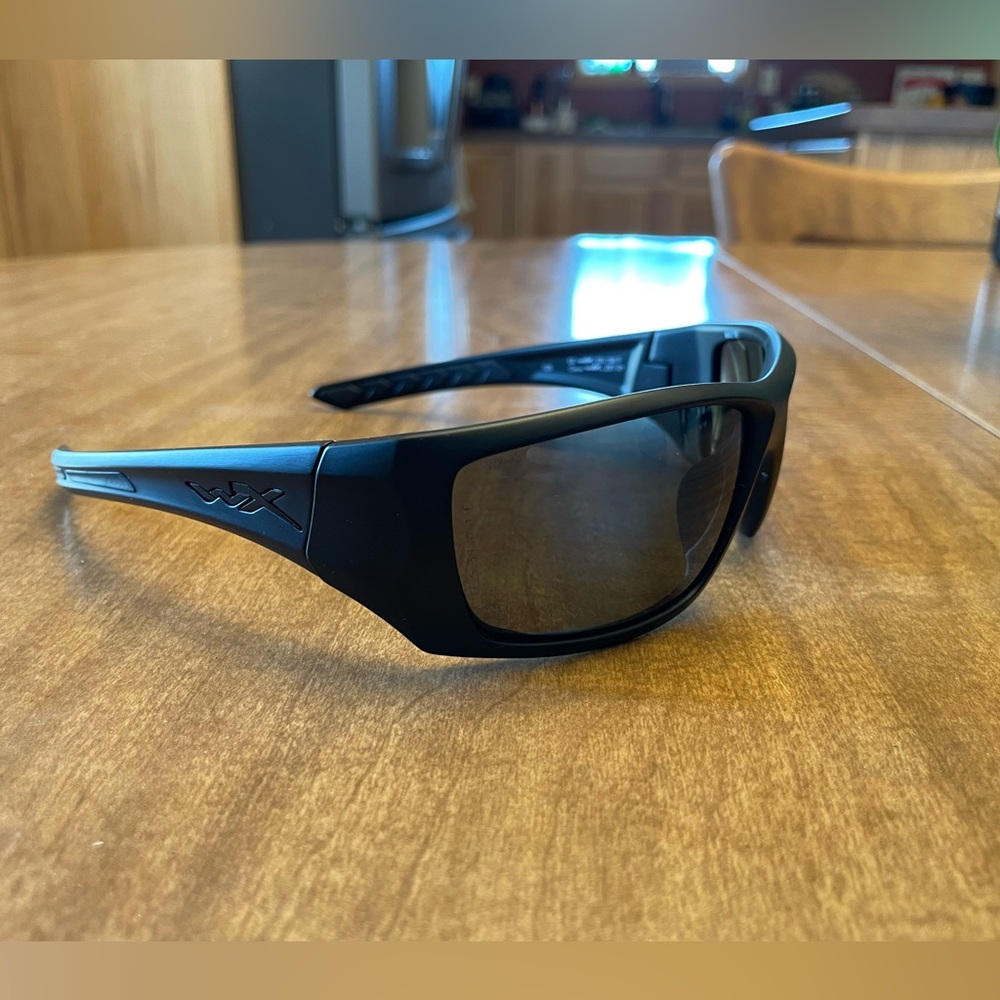 Black, Wiley X sunglasses, polarized, snug fit to the face.